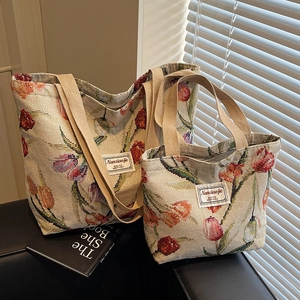 Two-piece large capacity floral tulip tote bag set on a leather sofa with props