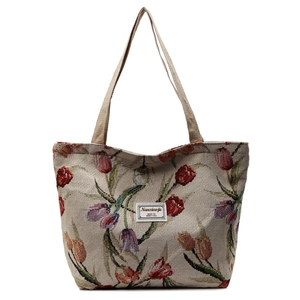 Large knit tote bag with vintage tulip floral patterns and stylish woven handles
