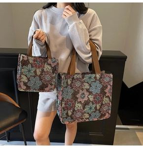 Close-up of vintage floral jacquard tote bag set with durable woven brown handles