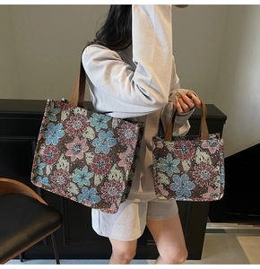 Detail of floral tapestry tote bags in two sizes featuring woven jacquard patterns