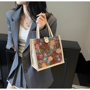 Detail of vintage floral tapestry tote with thick cotton rope handles and a large wooden button