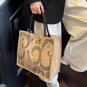 Large capacity jute tote bag with black vine print and top handles for women