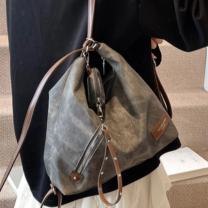 Vintage smoke grey large tote bag with brown leather straps worn over the shoulder