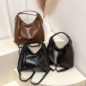 Retro soft leather tote backpack in brown, black, and coffee with tassel and side zipper