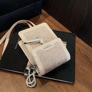 Chic beige embossed square crossbody bag with pearl heart charm and leaf texture leather