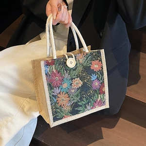 Linen lunch tote bag with floral tapestry pattern and woven rope handles