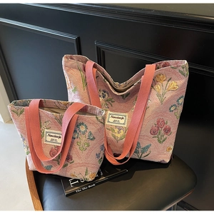 Close-up of floral jacquard woven fabric on a two-piece tote bag set with Nanciaojie label