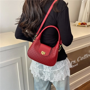 Elegant red woven dumpling bag for women with gold clasp and detachable shoulder strap