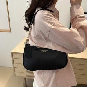 Black pebbled leather underarm shoulder bag with gold chain and 1936 fashion logo