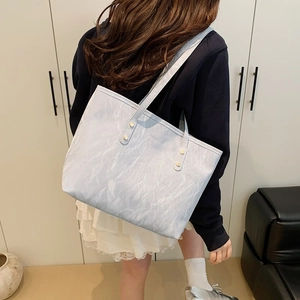 Minimalist marble pattern tote bag with gold hardware and spacious interior for women