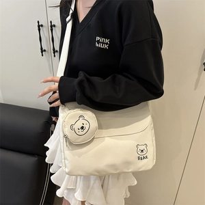 Minimalist beige canvas crossbody bag with cartoon bear print and small round coin purse