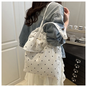 Detail of white floral mesh tote bag with ruffles and matching small coin purse