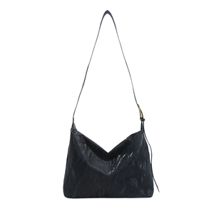 Minimalist large black hobo tote bag with unique crinkled texture and adjustable strap