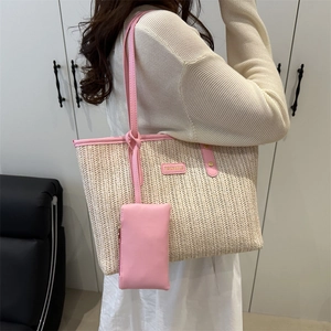 Grande borsa tote in paglia intrecciata con finiture in pelle rosa e mini borsellino incluso