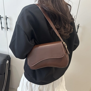 Minimalist dark brown irregular flap crossbody bag for women in premium retro PU leather