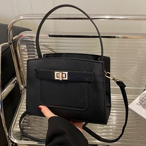 Black large capacity faux leather tote bag with gold metal clasp and crossbody strap