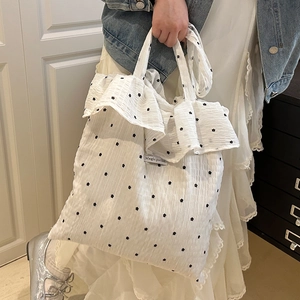 White ruffle shoulder bag with floral embroidery and Magic Pocket label for women