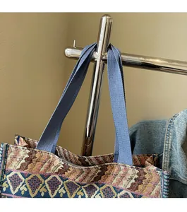 Detail of bohemian tote bag featuring ethnic jacquard fabric and durable blue wide strap