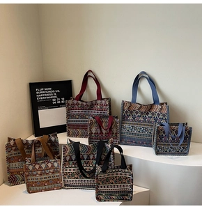 Detail of bohemian woven tote bags in various sizes with colorful handles and ethnic patterns