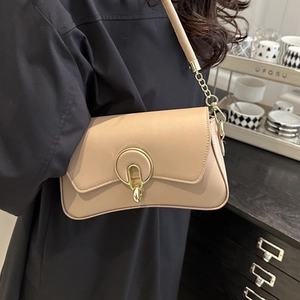 Minimalist beige crossbody bag for women with gold ring clasp and wide strap design