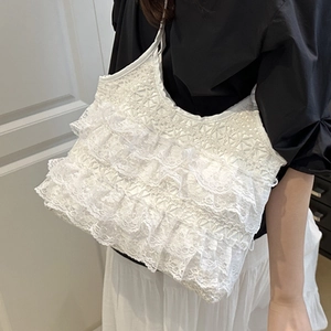 Elegant white lace tote bag with layered ruffle details and casual summer shoulder strap style