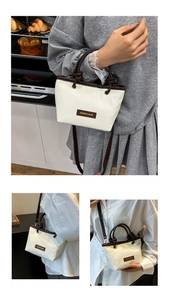 Close-up of beige woven texture and brown leather handle with knotted fashion detail