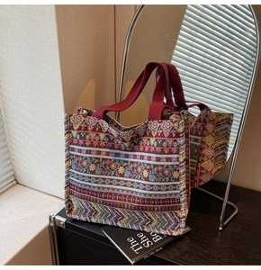 Detailed close-up of Bohemian tote bag featuring ethnic patterns on a dark wooden surface