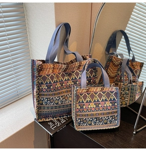 Close-up of bohemian woven tote bags in two sizes with ethnic geometric patterns