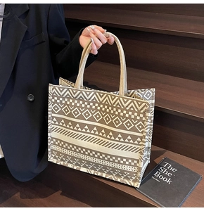 Close-up of geometric canvas tote bag featuring woven texture and high-capacity structure