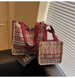 Close-up of Bohemian jacquard tote bag set with ethnic patterns and red woven handles