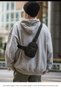 Waterproof black nylon crossbody bag shown on a 165cm female model in street setting