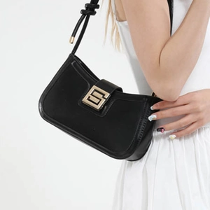 Minimalist black matte leather underarm bag with vintage gold geometric buckle for women