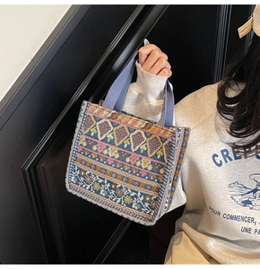 Macro view of bohemian jacquard fabric detail and woven texture on a tote handbag