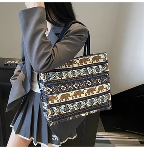 Detail of bohemian canvas tote featuring vintage elephant pattern and spacious design