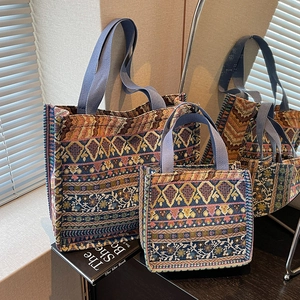 Set of two Bohemian woven tote bags with ethnic geometric patterns in a lifestyle setting