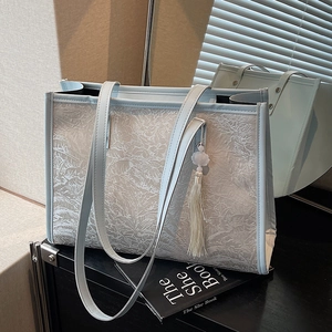 Large light blue lace jacquard tote bag with tassel pendant for stylish daily commuting
