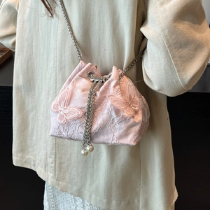 Pink lace drawstring bucket bag with butterfly embroidery and pearl chain strap