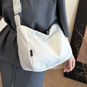 Minimalist white wide-strap crossbody bucket bag with FANYISSA brand label for women