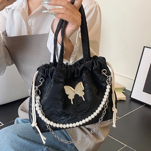 Black ruched drawstring backpack with silver butterfly detail and pearl chain decoration