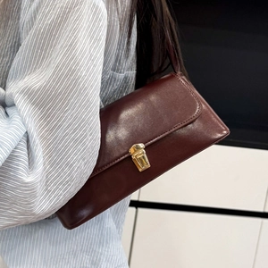 Vintage burgundy baguette shoulder bag with gold clasp and smooth leather finish
