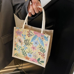 Florale Canvas-Lunchtasche mit gelber Webstruktur und weißen Seilgriffen