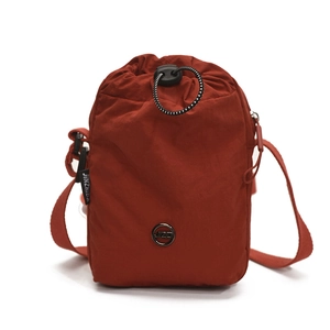 Waterproof red nylon drawstring crossbody bag for women with adjustable shoulder strap