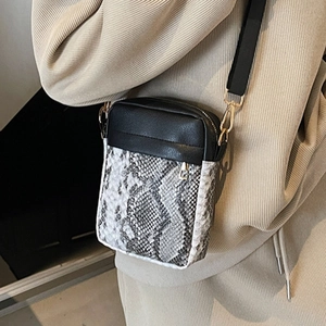 Black and snakeskin chain crossbody bag with adjustable strap for fashion-forward women