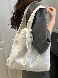White lace tote bag with floral embroidery and large bow detail for daily casual wear