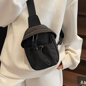 Minimalist black nylon crossbody phone bag with drawstring flap for casual daily wear