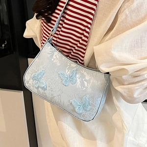 Light blue crescent tote bag with 3D butterfly embroidery and floral jacquard patterns