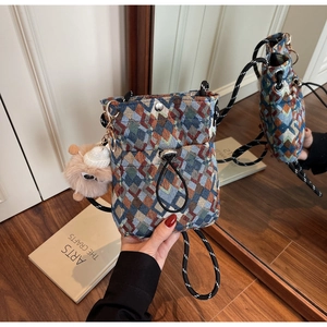 Floral plaid crossbody chest bag with drawstring closure and plush lamb charm detail