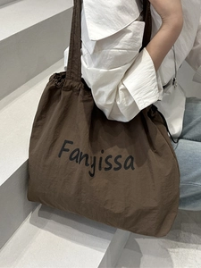 Spacious dark brown nylon tote bag with drawstring closure and Fanyissa script lettering