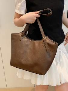 Vintage dark brown large tote bag with leather texture and adjustable shoulder straps