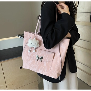 Detailed pink tote bag with pleated texture, silver butterfly buckle and cloud charm